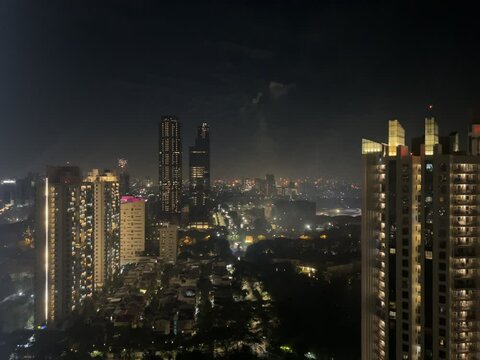 New Year's Eve celebration in Kemayoran Jakarta with beautiful lights from high-rise buildings and fireworks at night