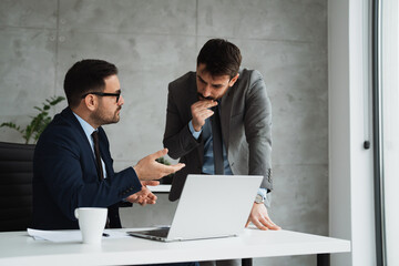 Two business people working at office