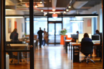 blurred background of office with people working and collaborating