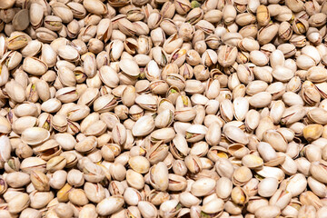 Food background with  closeup of a bunch of pistaches nuts in shell