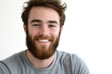 Obraz premium A happy man with a beard smiles at the camera