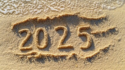 Fototapeta premium A close-up shot of the word '2012' written in the sand on a sunny beach