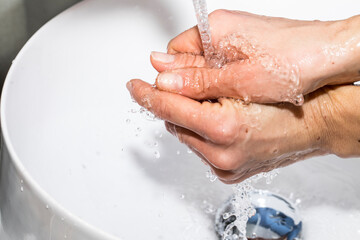 Fototapeta premium washing hands with soap. Hands. Woman hand. Background. Water. Relax. Oil. 