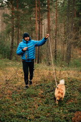 man with a dog in the forest