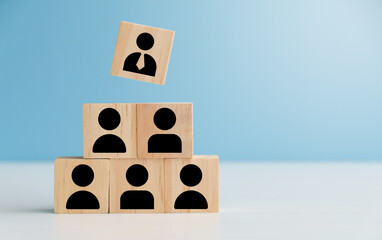 A pyramid of wooden blocks, each displaying a person icon, highlights a single, distinguished...
