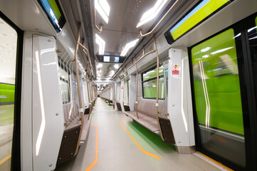 Interior of the modern subway carriage with empty seats