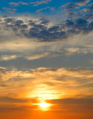 Fototapeta premium majestic sunrise sundown sky background with gentle colorful clouds without birds. Vertical photo.
