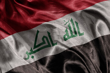 shine waving colorful realistic national flag of iraq .