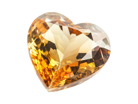 A close up image of a heart shaped topaz gemstone displaying its facets and warm golden hues.