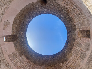 Split, Croatia - July 1, 2024: Historic downtown. Looking straigth up from under the open dome of Vestibule historic building in Diocletian Palace