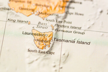 World map. Tasmania island on the geographical map, world tourism, destination. Political map close-up photo.