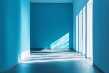 Obraz premium A bright blue room illuminated by soft natural light and shadows.