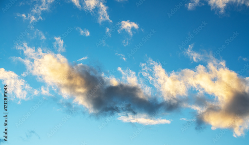 Wall mural beautiful orange sunset clouds on the blue sky. sky background.