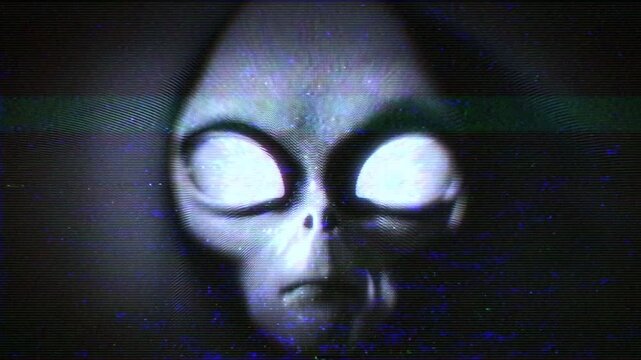 An Alien Grey face emerges from hypnotic television white noise static with a weak TV signal and noise effects.