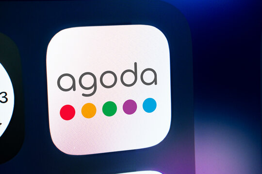 Dhaka, Bangladesh- 21 jan 2025: A close up of an iPhone screen displaying the Agoda logo. Agoda is an online travel agency.