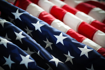 macro waves of fabric in the United States american flag red white blue stars and stripes patriotic close-up elegant background