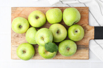 Fresh ripe green apples on white table, top view