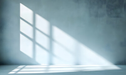 Obraz premium Minimal abstract light blue background for product presentation. Shadow and light from windows on plaster wall.
