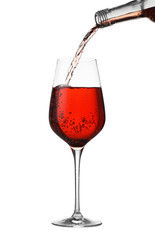 Pouring wine into glass on white background