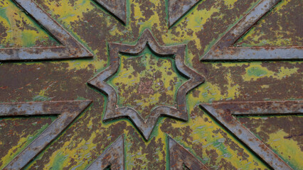 Texture of an oxidised sheet metal with a star