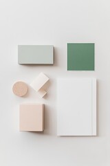 flat lay of green approval stamp and clean white document arranged neatly on matte white surface