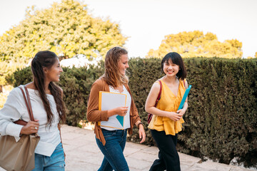 University exchange students walking and talking on campus