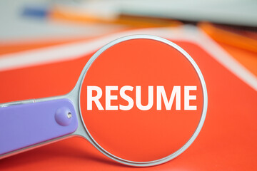 Resume text magnifying glass background