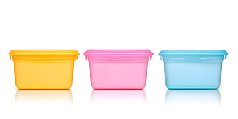 Three colorful plastic containers on a white background. Ideal for food storage or organization.