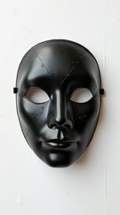 Black mask with visible stitching and texture on white background