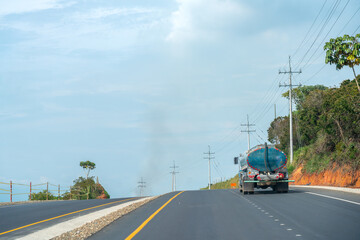 Water transport truck on a tropical climate highway in Colombia.