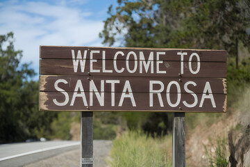 Rustic Wooden Sign Welcoming Visitors to Santa Rosa California with Warm Invitation and State Pride