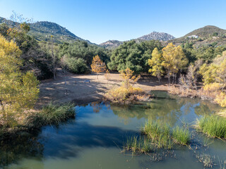 Aerial view of small lake in the in the valley of Dos Picos County Park in Ramona, South California, USA