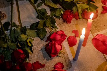 Sao Paulo, SP, Brazil - December 13 2024: Red roses and candles details.
