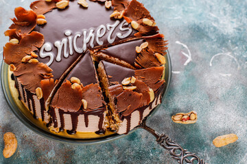 Snickers cake with caramel, peanuts and buttercream.
