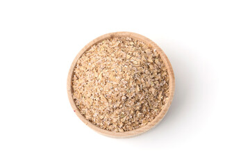 Buckwheat bran in wooden bowl isolated on white, top view