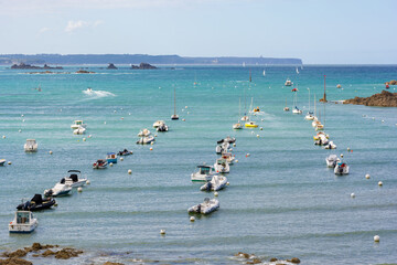 Boats lined up in bay during high tide in Brittany in France