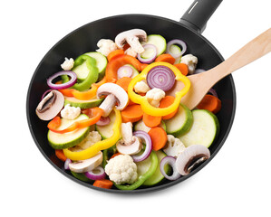 Frying pan with mix of vegetables and mushrooms in air isolated on white