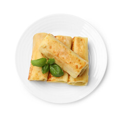 Delicious rolled crepes with basil isolated on white, top view