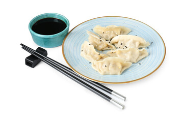 Tasty gyoza (dumplings), soy sauce and chopsticks isolated on white