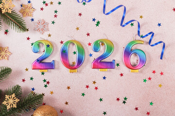 Holiday sparkling background Happy New Year 2026. Rainbow colored candles with numbers of year 2026...