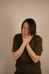 Sore throat. A beautiful woman with a sore throat, feeling sick. Health concept. High resolution.