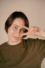 The simplicity of her makeup subtly draws attention to her striking gray eyes, which hold a...