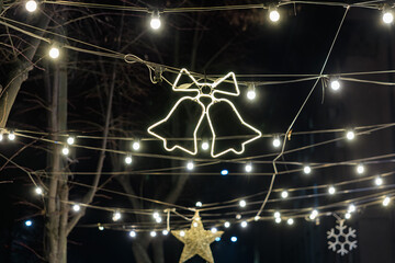 Festive holiday lights and decorations in outdoor winter night scene