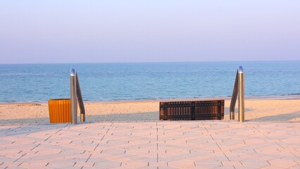 Ocean waves meet eco-friendly beachfront pathways, travel merging sustainability with coastal charm. Beachfront developments highlight ocean preservation and eco-conscious travel values.