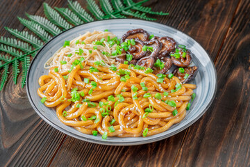 Udon Noodles with Soy Unagi Sauce, Mushrooms, and Green Onion