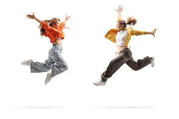 Two young women jumping
