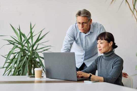 business meeting businesswoman woman young office businessman teamwork laptop startup colleague seminar businessperson man startup creative training computer - Powered by Adobe