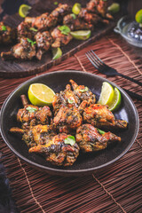 Deliciously grilled chicken wings with lime and herbs
