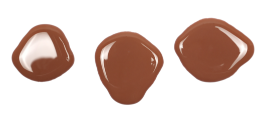 Spilled chocolate milk puddle isolated on white background, top view
