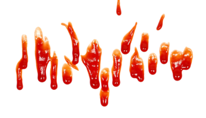 Red ketchup droplets isolated on white background	